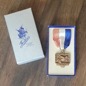 Jostens Vintage Bronze Track Medal with Red White and Blue Ribbon